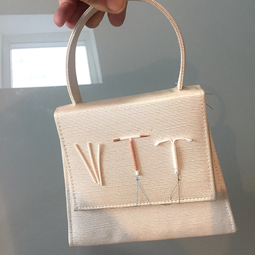 A handbag decorated with Long Acting Reversible Contraceptives